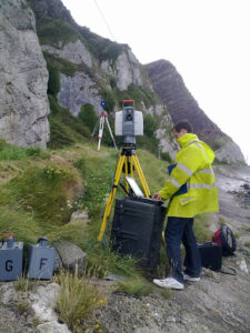 Surveyor using equipment outside on moors