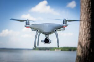 flying drone next to water
